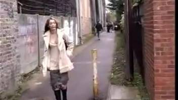 Lady urinating in the back alley